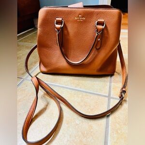 Camel colored medium sized Kate Spade handbag. Excellent, clean condition.